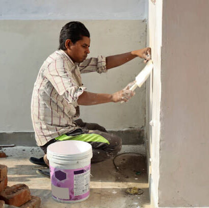 istockphoto-1482449263-612x612 Painter man at work with a paintbrush at home on the wall during Diwali festival.